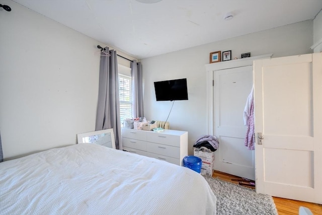 69-71 Pond St, Waltham, MA 02451 - bedroom with light wood-style floors