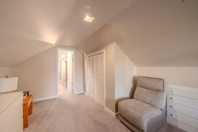 69-71 Pond St, Waltham, MA 02451 - sitting room featuring carpet, vaulted ceiling, and baseboards