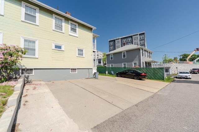 69-71 Pond St, Waltham, MA 02451 - back of property with a chimney