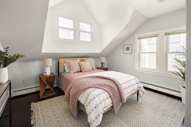 bedroom featuring multiple windows, a baseboard heating unit, and lofted ceiling