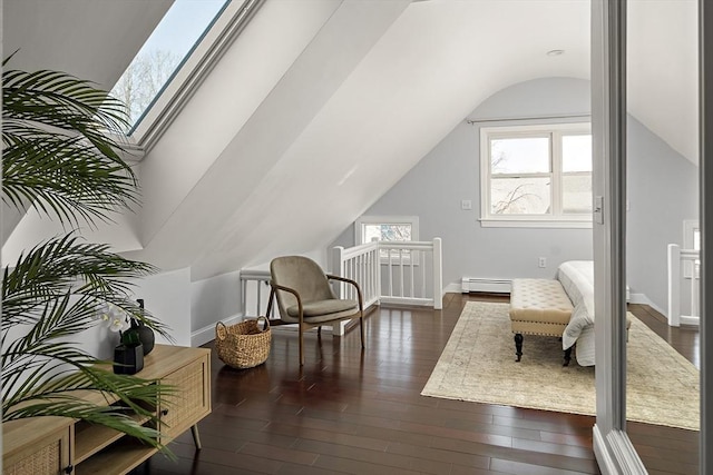 living area with an upstairs landing, lofted ceiling with skylight, dark wood-style floors, baseboards, and baseboard heating