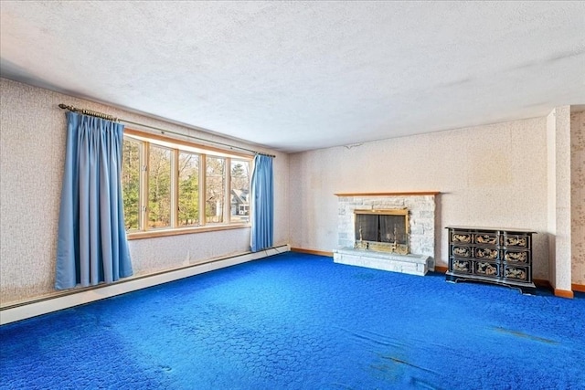 unfurnished living room with carpet flooring, a textured ceiling, a fireplace, and baseboard heating