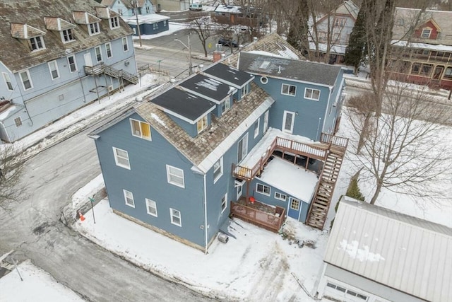 snowy aerial view featuring a residential view