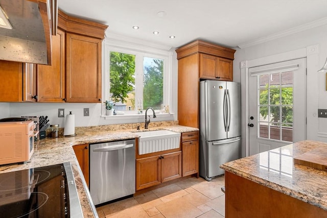19 Brown Ct, Methuen, MA 01844 - kitchen featuring stainless steel appliances, crown molding, a sink, light stone countertops, and brown cabinetry