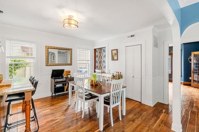 19 Brown Ct, Methuen, MA 01844 - dining area featuring light wood-style flooring, ornamental molding, and baseboards