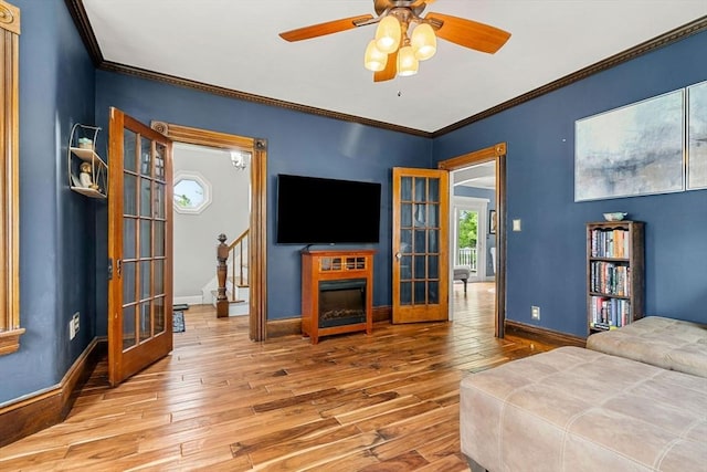 19 Brown Ct, Methuen, MA 01844 - bedroom featuring hardwood / wood-style flooring, french doors, ornamental molding, baseboards, and ceiling fan