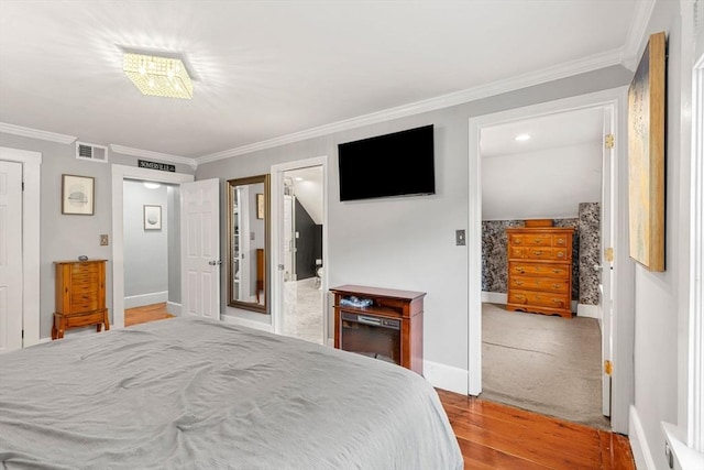 19 Brown Ct, Methuen, MA 01844 - bedroom featuring ornamental molding, wood finished floors, and baseboards