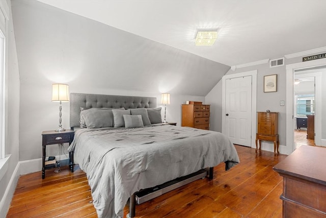 19 Brown Ct, Methuen, MA 01844 - bedroom featuring hardwood / wood-style flooring, baseboards, crown molding, and vaulted ceiling