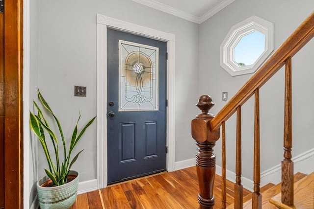 19 Brown Ct, Methuen, MA 01844 - foyer featuring wood finished floors, baseboards, stairway, ornamental molding, and plenty of natural light