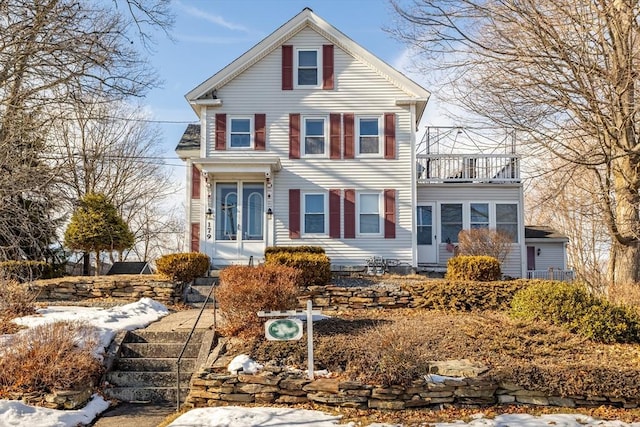 view of front of home with a balcony