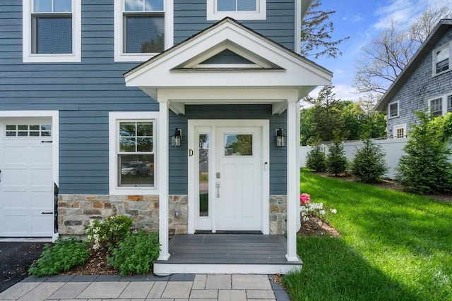 114 Broad St Unit D, Weymouth, MA 02188 - property entrance featuring stone siding and a garage
