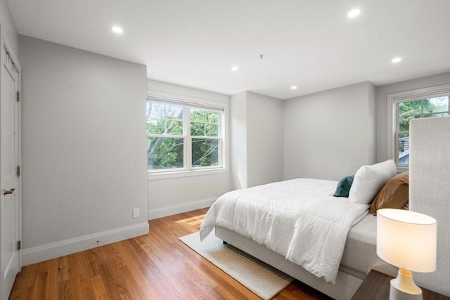 114 Broad St Unit D, Weymouth, MA 02188 - bedroom featuring multiple windows, wood finished floors, recessed lighting, and baseboards