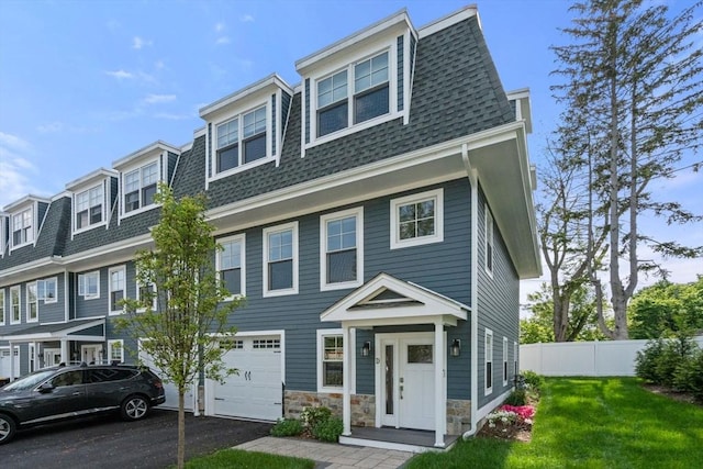 114 Broad St Unit D, Weymouth, MA 02188 - view of front of property with roof with shingles, a garage, and driveway