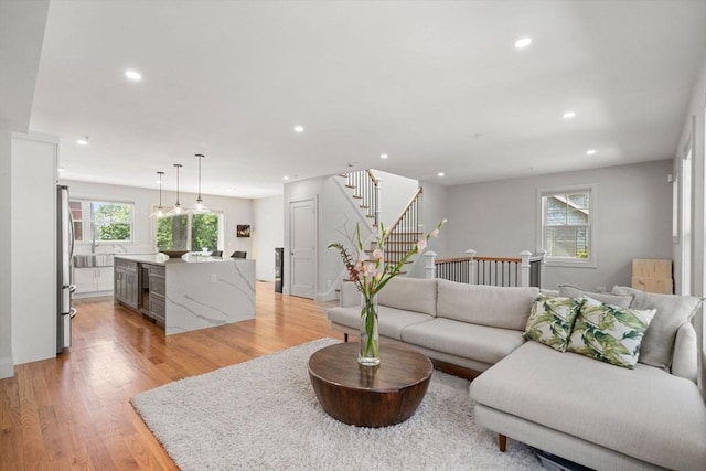 114 Broad St Unit D, Weymouth, MA 02188 - living area featuring recessed lighting, stairs, light wood-type flooring, and beverage cooler
