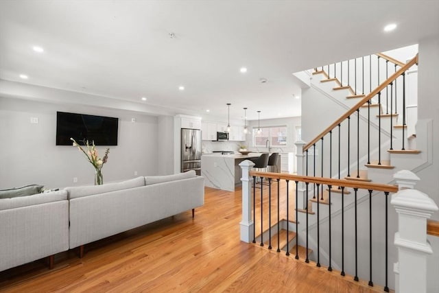 114 Broad St Unit D, Weymouth, MA 02188 - living area with recessed lighting, light wood-type flooring, and stairway