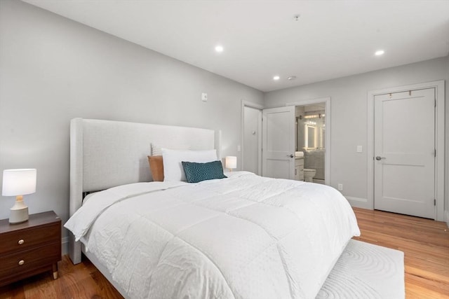 114 Broad St Unit D, Weymouth, MA 02188 - bedroom with wood finished floors, recessed lighting, and connected bathroom