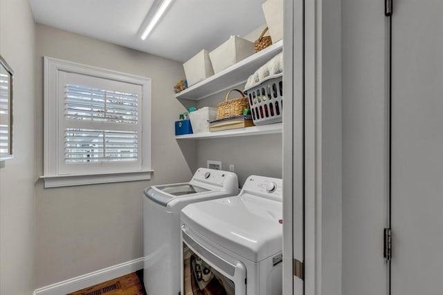 clothes washing area featuring washer and clothes dryer