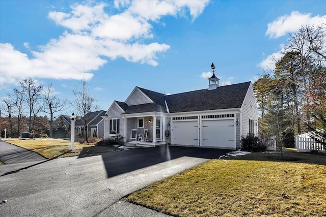 view of front of house featuring a garage and a front yard