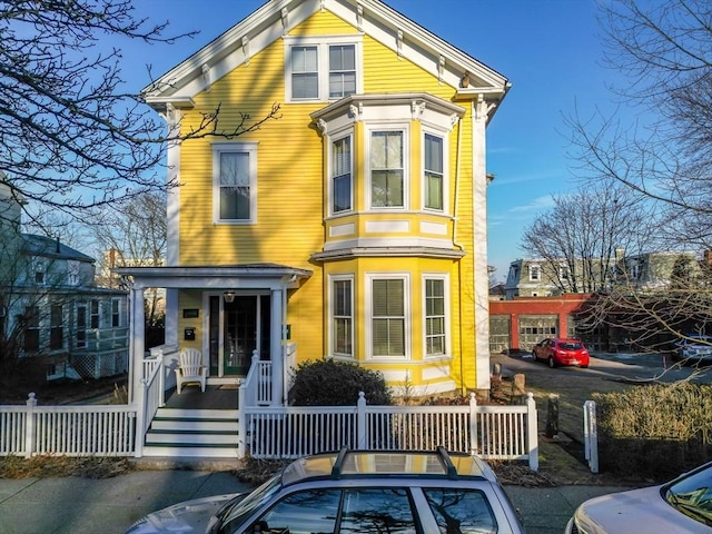 36 7th St, New Bedford, MA 02740 - italianate-style house featuring a porch
