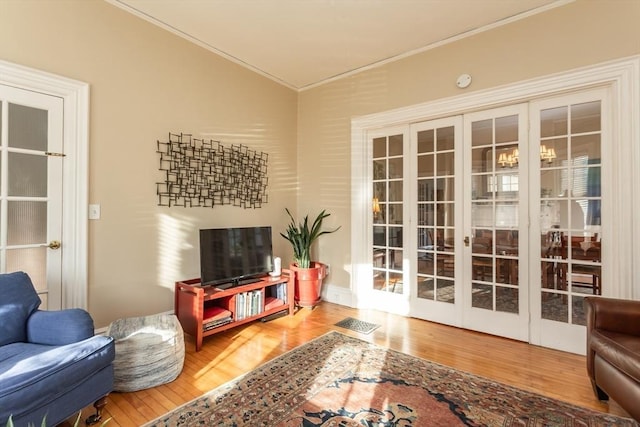 36 7th St, New Bedford, MA 02740 - living area with crown molding, wood finished floors, and french doors
