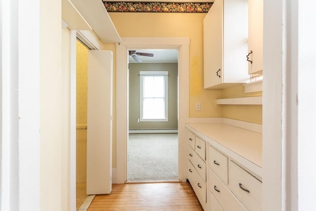 36 7th St, New Bedford, MA 02740 - hall featuring a baseboard heating unit and light wood finished floors