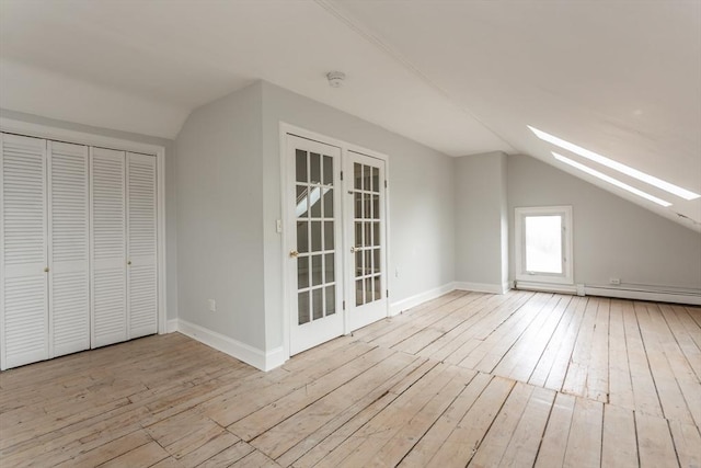 36 7th St, New Bedford, MA 02740 - bonus room with vaulted ceiling, a skylight, wood-type flooring, french doors, and baseboards