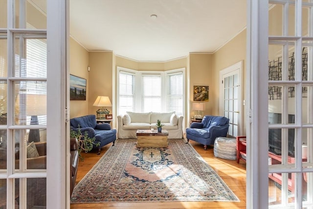 36 7th St, New Bedford, MA 02740 - living room featuring wood finished floors, crown molding, and french doors
