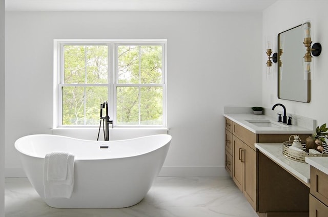 19 Couture Way, Middleton, MA 01949 - bathroom featuring vanity, a freestanding bath, and marble finish flooring