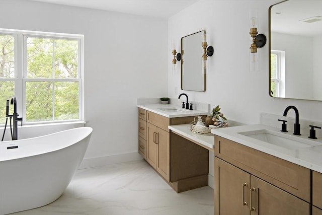19 Couture Way, Middleton, MA 01949 - bathroom featuring two vanities, marble finish floors, and a freestanding tub