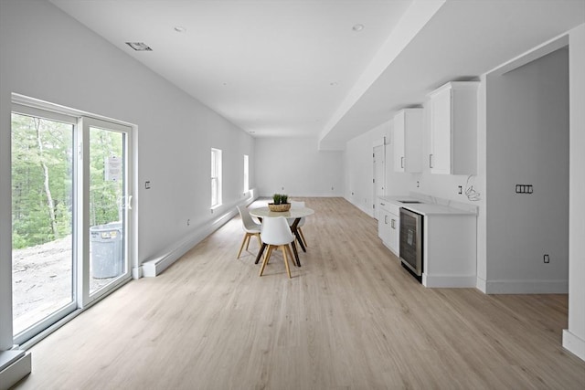 19 Couture Way, Middleton, MA 01949 - unfurnished dining area featuring wine cooler and light wood-style flooring