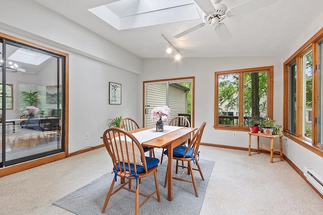 24 Squirrel Hill Rd, Acton, MA 01720 - dining area featuring a skylight, a baseboard heating unit, track lighting, light carpet, and vaulted ceiling