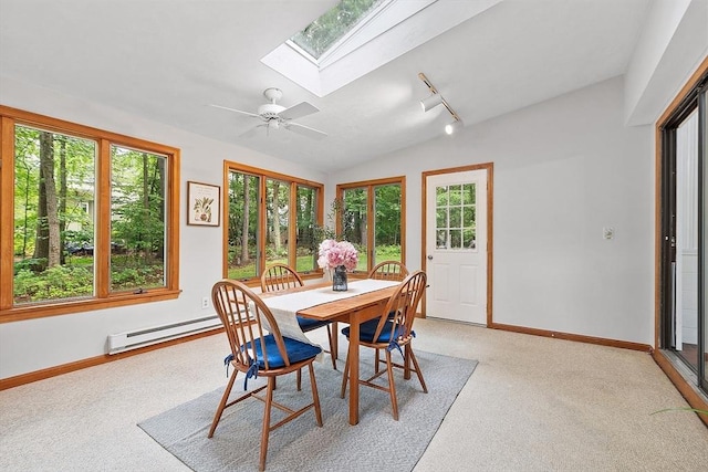 24 Squirrel Hill Rd, Acton, MA 01720 - dining space featuring a baseboard radiator, a skylight, vaulted ceiling, light colored carpet, and rail lighting