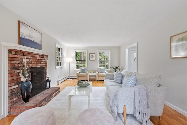 24 Squirrel Hill Rd, Acton, MA 01720 - living room featuring light wood-style floors, a baseboard heating unit, and a brick fireplace