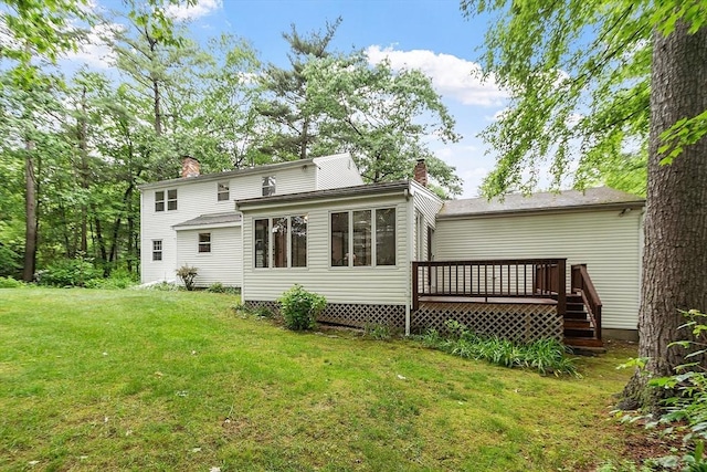 24 Squirrel Hill Rd, Acton, MA 01720 - back of property with a chimney, a wooden deck, and a lawn