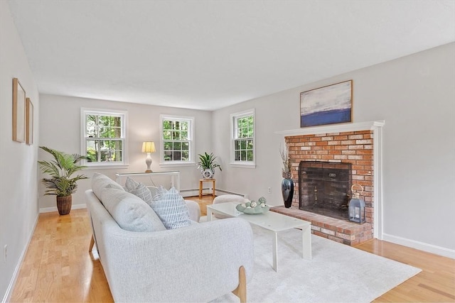 24 Squirrel Hill Rd, Acton, MA 01720 - living room featuring light wood finished floors and a fireplace