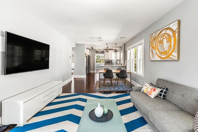 95-97 Charlesbank Rd Unit 2, Newton, MA 02458 - living area featuring dark wood-style flooring and baseboards