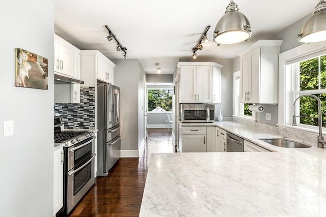 95-97 Charlesbank Rd Unit 2, Newton, MA 02458 - kitchen with stainless steel appliances, light stone counters, rail lighting, and plenty of natural light