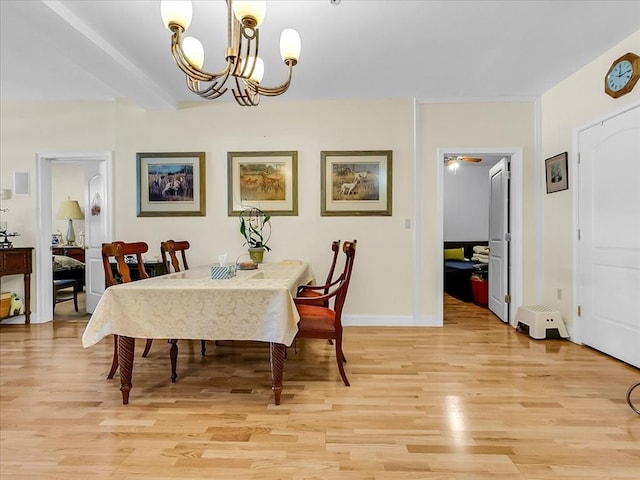 dining room featuring light hardwood / wood-style floors and a notable chandelier