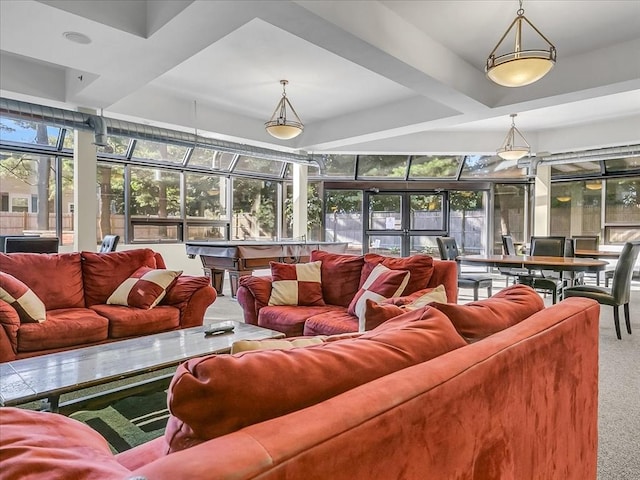 sunroom / solarium with a raised ceiling and plenty of natural light