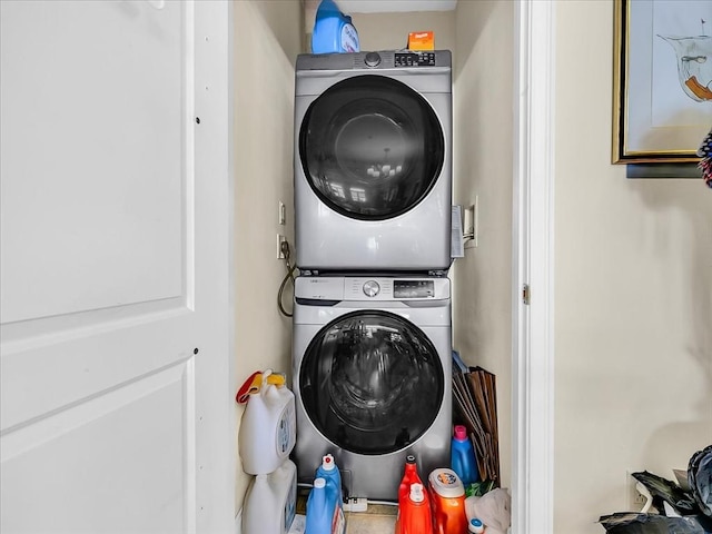 laundry room with stacked washer / dryer