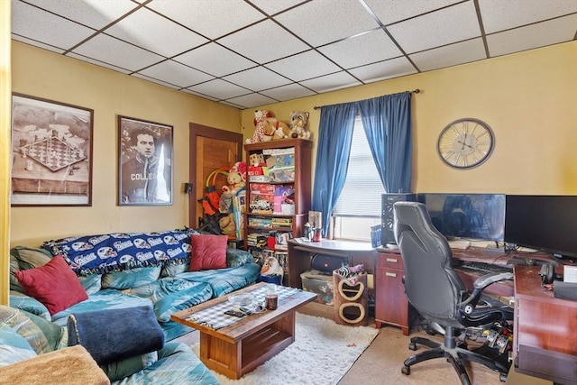 carpeted office space with a drop ceiling
