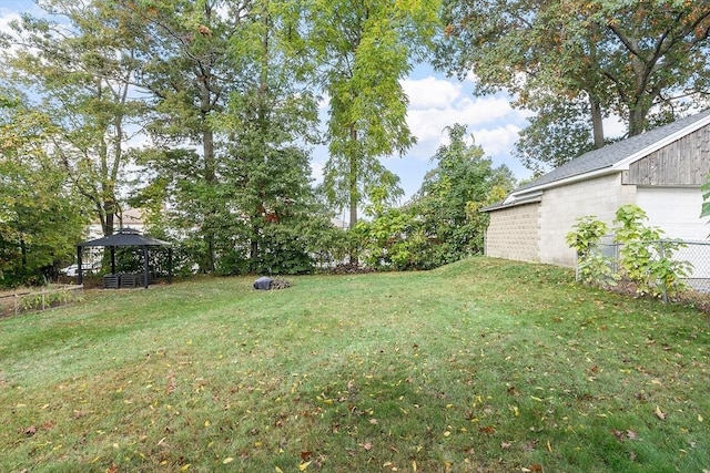 view of yard with a gazebo and a garage