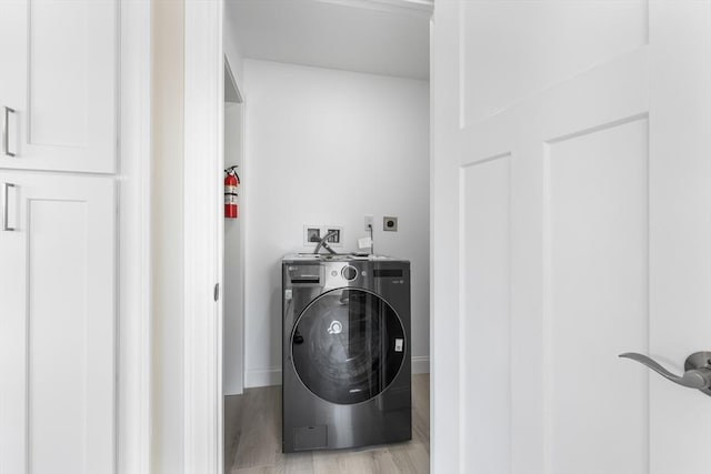 112 W Main Unit 5, Barnstable, MA 02601 - laundry room with washer / dryer and light wood-type flooring