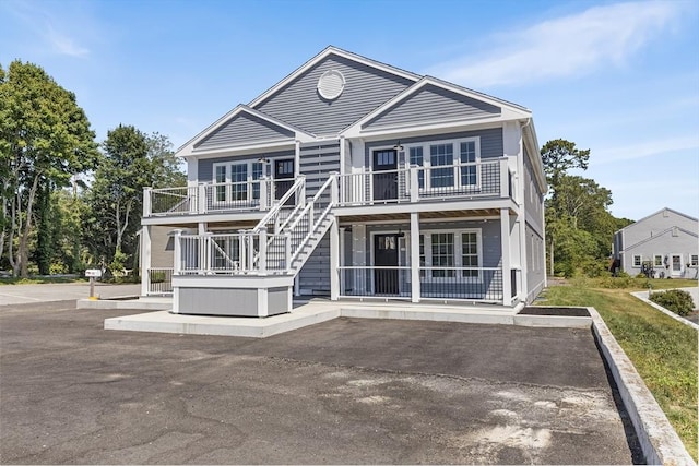 112 W Main Unit 5, Barnstable, MA 02601 - rear view of house with a balcony, stairs, and covered porch