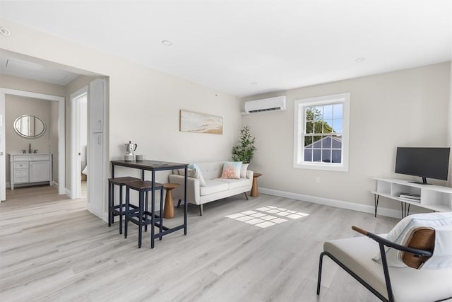 112 W Main Unit 5, Barnstable, MA 02601 - living area featuring a wall unit AC and wood finished floors