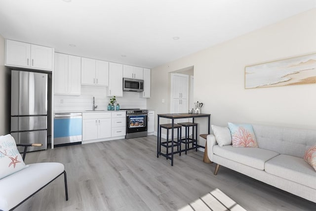 112 W Main Unit 5, Barnstable, MA 02601 - living area with light wood-style flooring