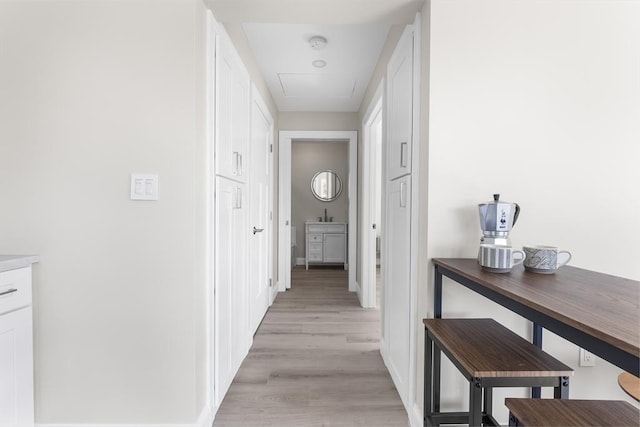 112 W Main Unit 5, Barnstable, MA 02601 - hallway featuring attic access and light wood-type flooring