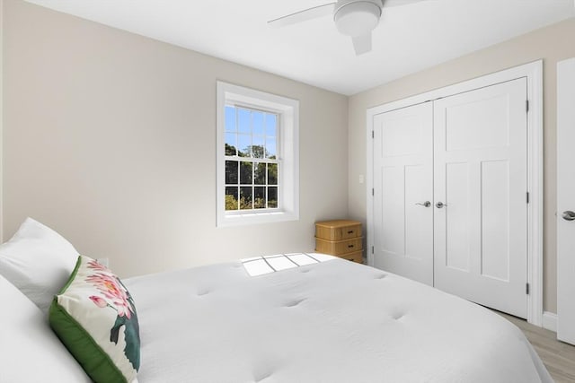 112 W Main Unit 5, Barnstable, MA 02601 - bedroom with light wood finished floors, a ceiling fan, and a closet