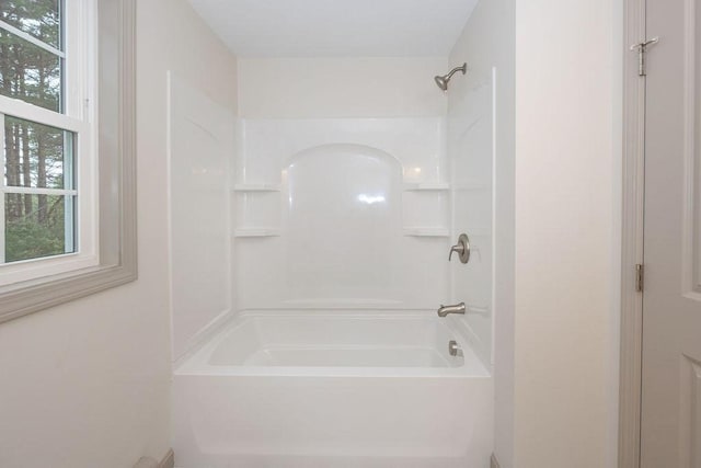 full bath featuring washtub / shower combination