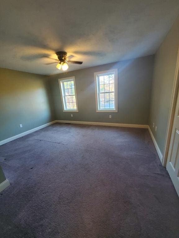 carpeted empty room with ceiling fan